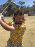 Aussie golfer with a mullet mid-swing in the Golden Hour beer print polo